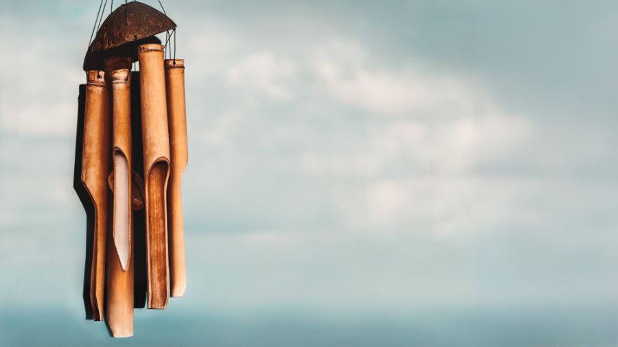 Bamboo tube wind chime with light blue sky background