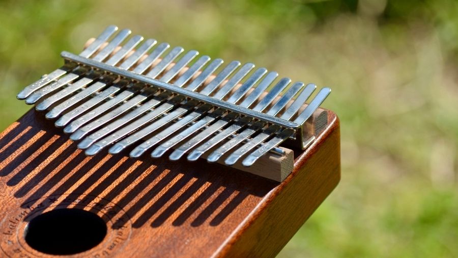 Close-up of a traditional kalimba illuminated by warm sunlight.