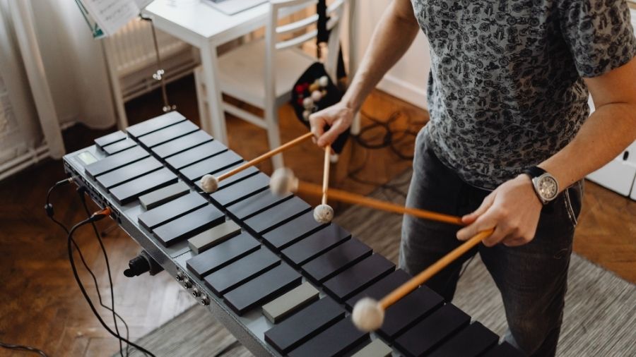 High-angle shot of a person playing a xylophone.