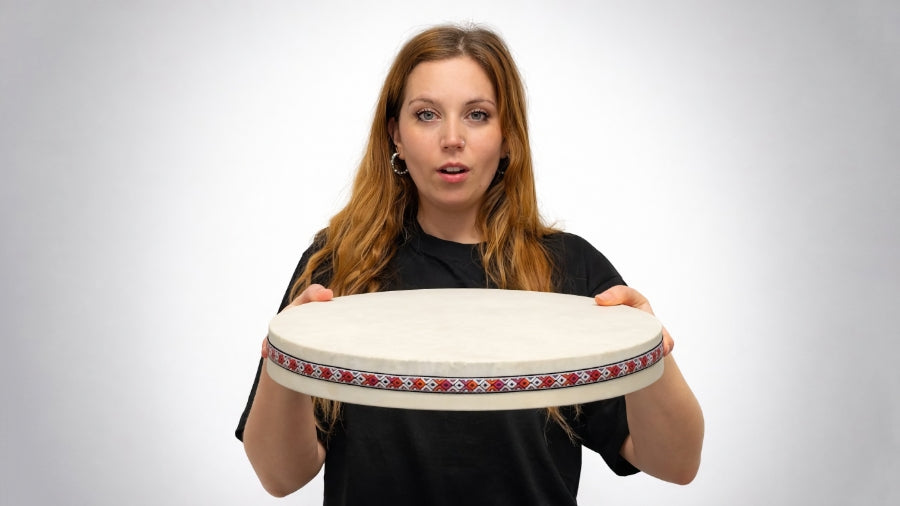Person playing ocean drum with proper hand position and tilt