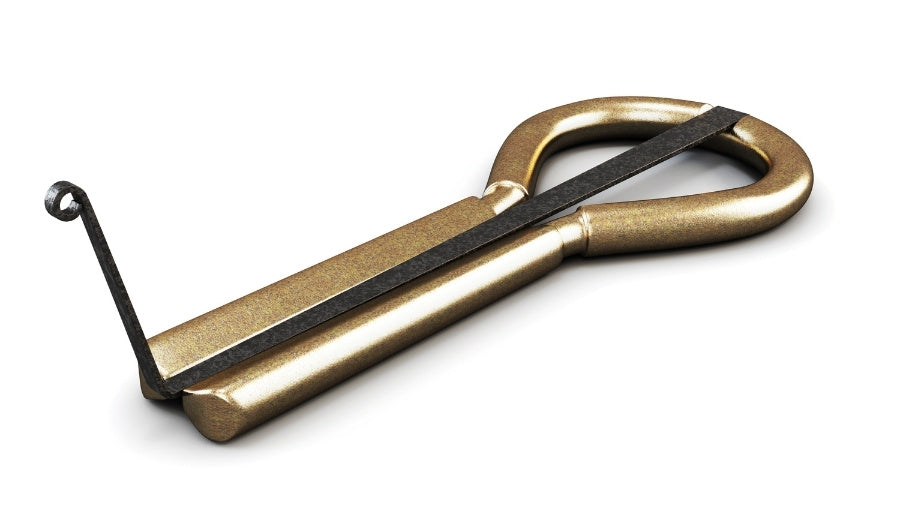 Cast Iron Jaw Harp on a white background