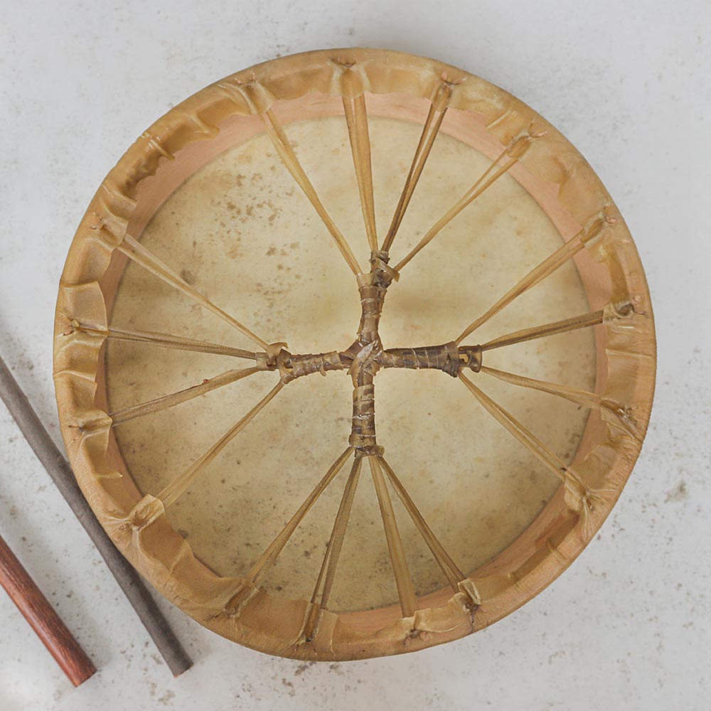 Close up of the 40cm Khenji Shamanic drum back showing the animal hide ties and handle grip