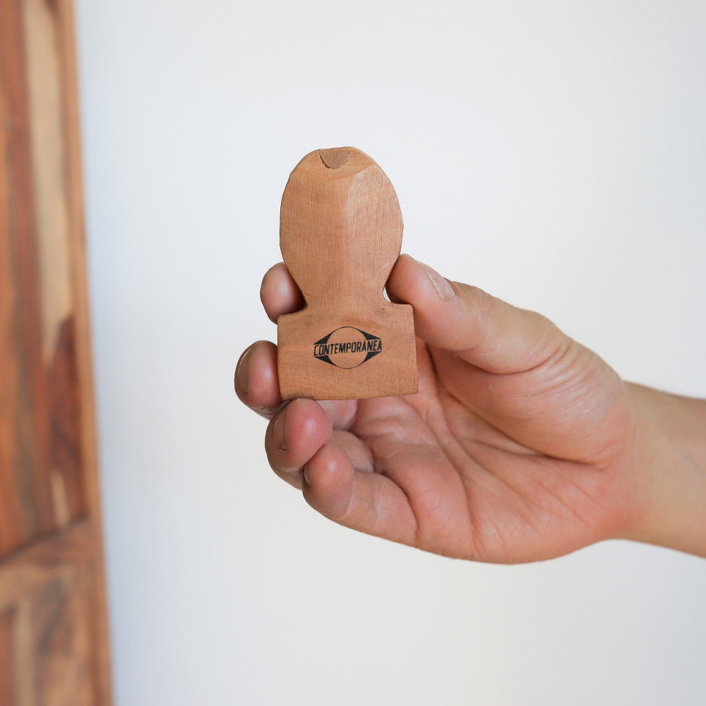 samba whistle in hand