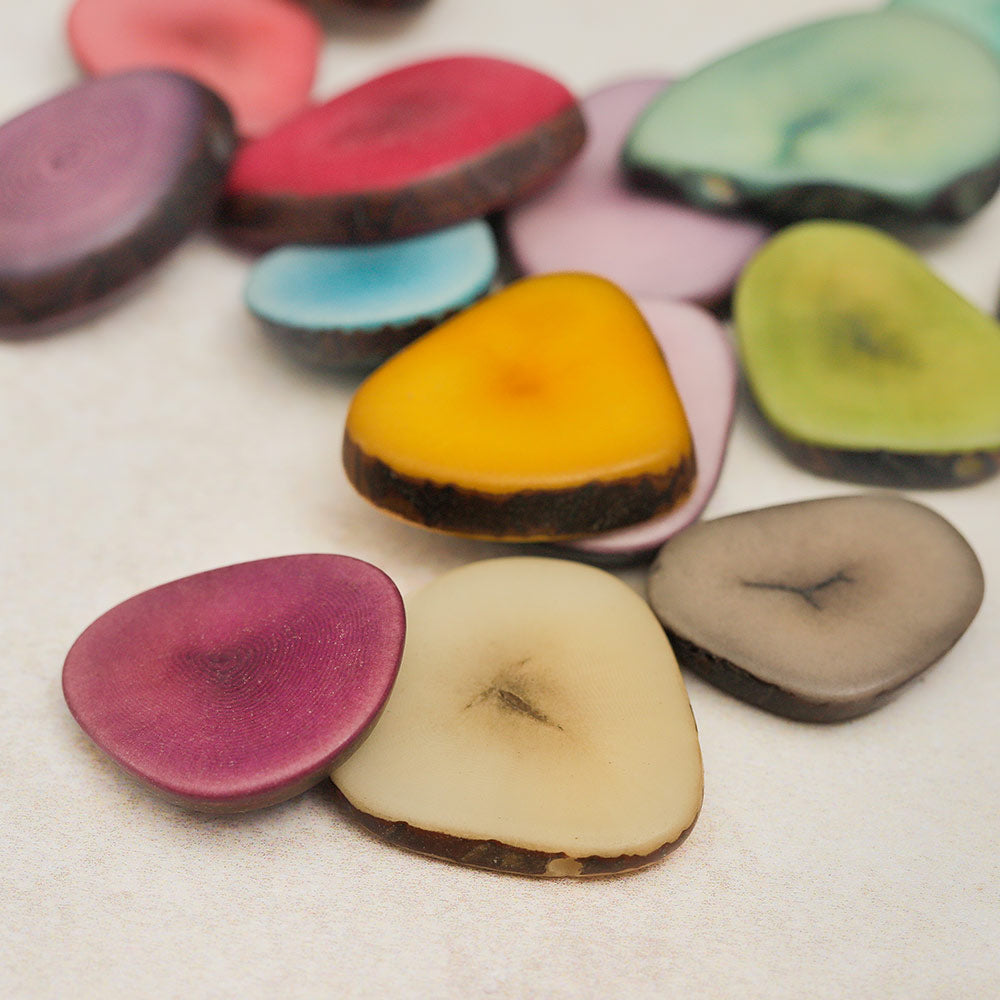 Close-up of vibrant colourful Tagua nut seeds showcasing their natural texture and unique patterns.