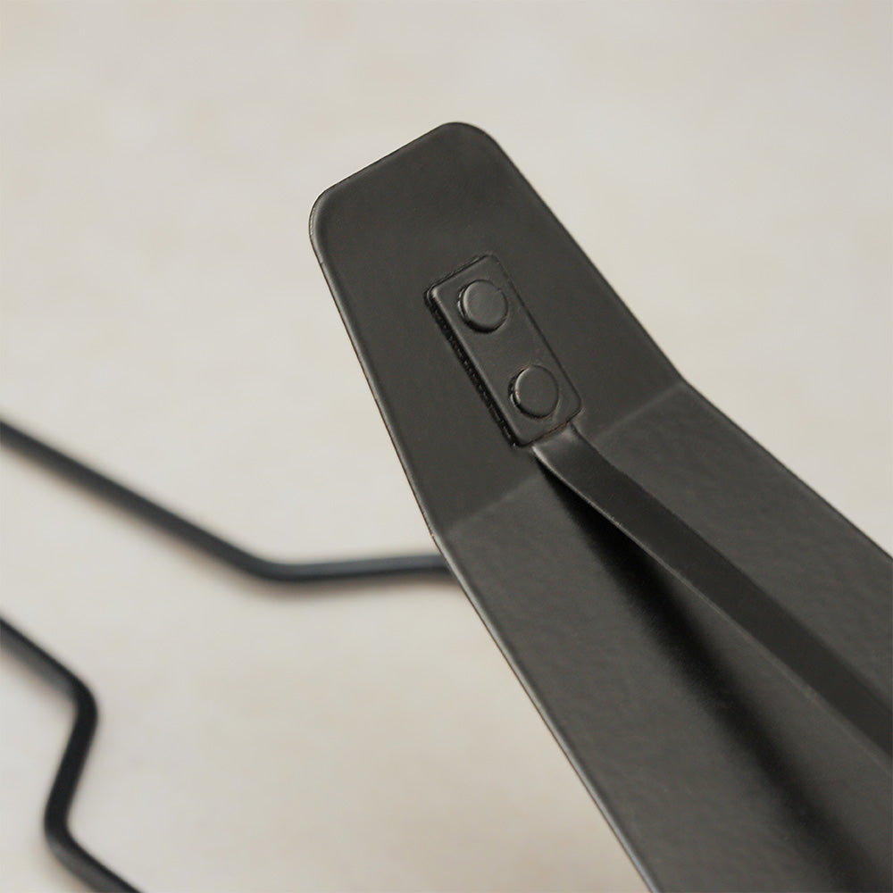 Close-up of the metal flexatone base mechanism, highlighting its construction and moving parts.