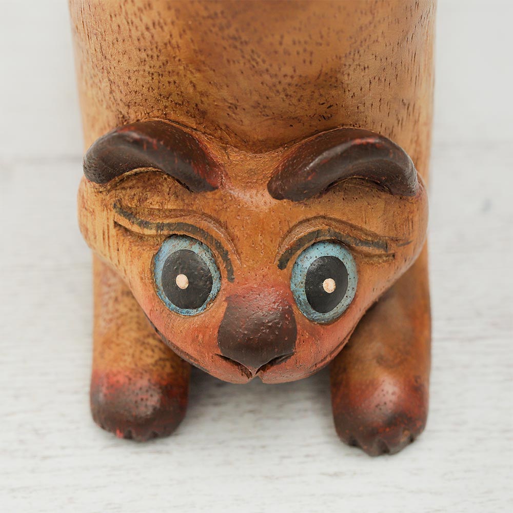 Close-up of the Purring Cat Wooden Whistle Guiro, highlighting the fine wood details and kitty design.