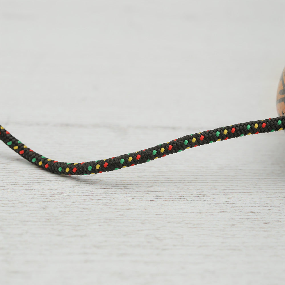 Close-up of the rope that connects the Geometric Kashaka shaker balls together, showing the detailed knotwork and texture.