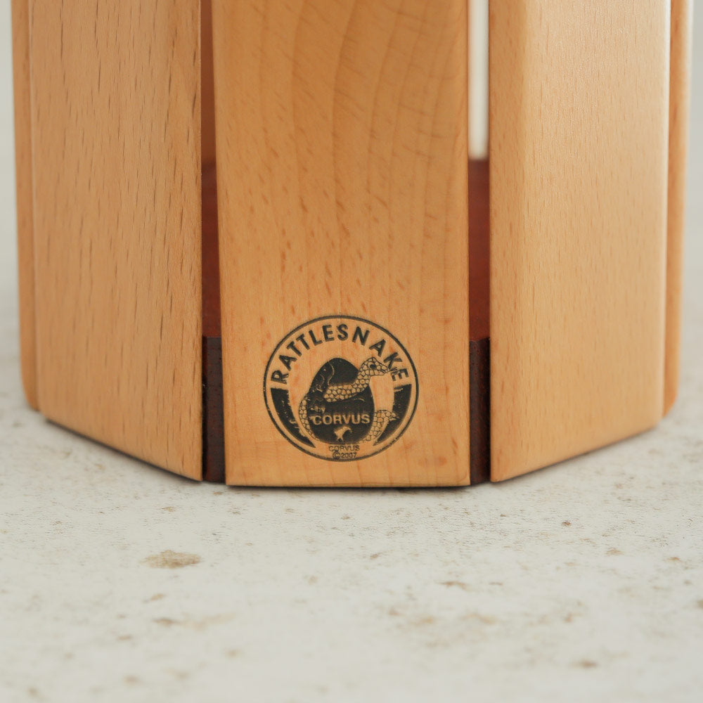 Close up of the rattlesnake Corvus Logo on the wooden xylophone instrument