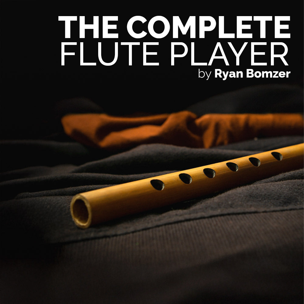 Flute on a dark surface with 'The Complete Flute Player' by Ryan Bomzer text above