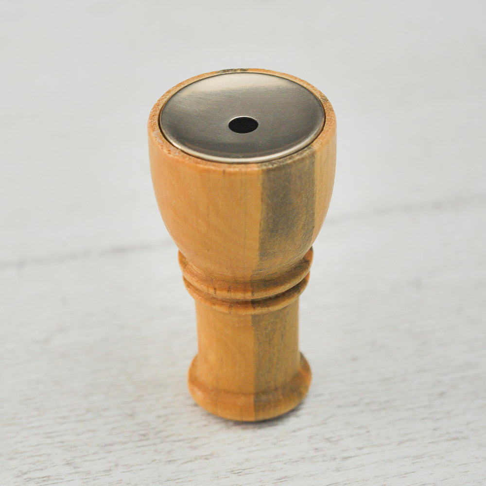 Close-up of the Eurasian Skylark bird caller facing upright, showing the detailed wooden design and mouthpiece.