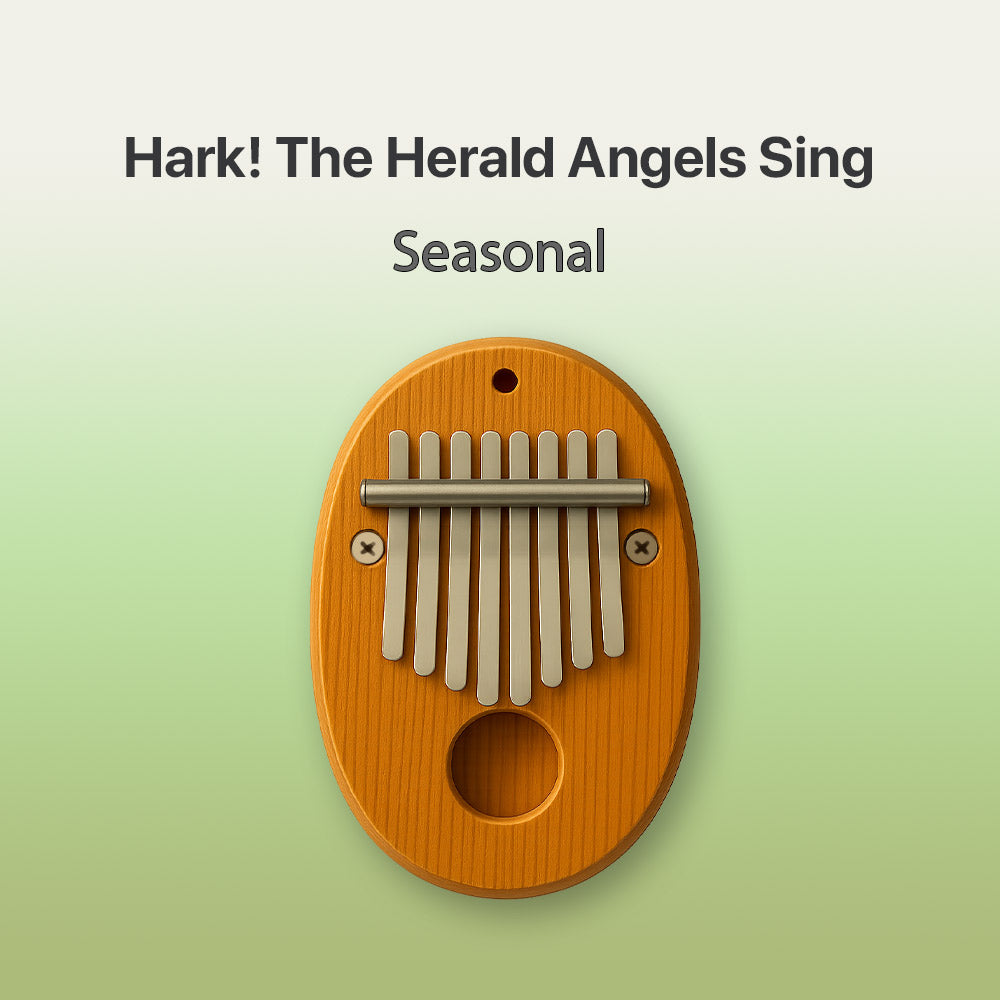 Wooden kalimba with metal tines on a light green background, featuring text 'Hark! The Herald Angels Sing Seasonal'.