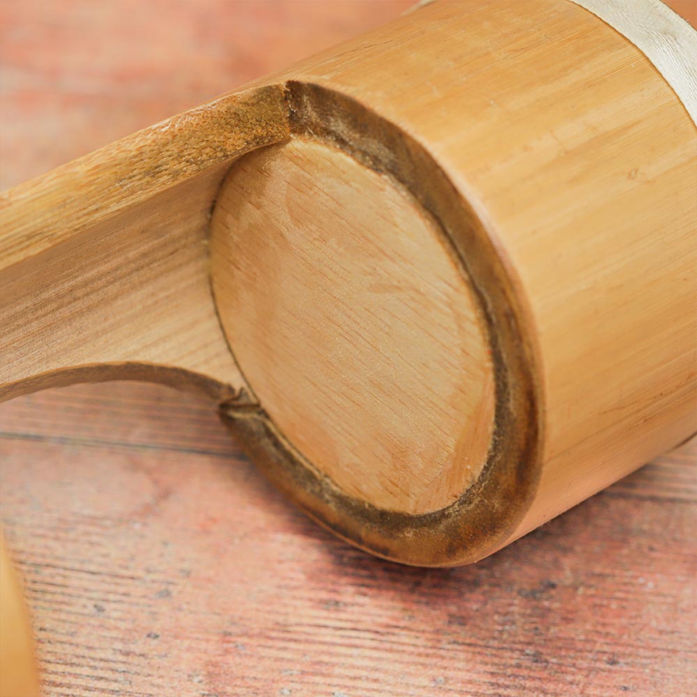 Close-up of the middle part of the Jati Guiro Drum Shaker bamboo frame showing the natural texture.