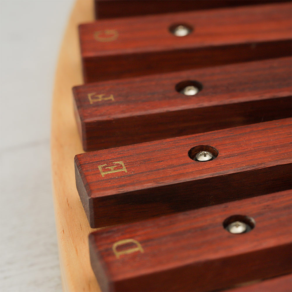 Close-up of the Kosbaar Xylophone highlighting the letter notes and rosewood keys.