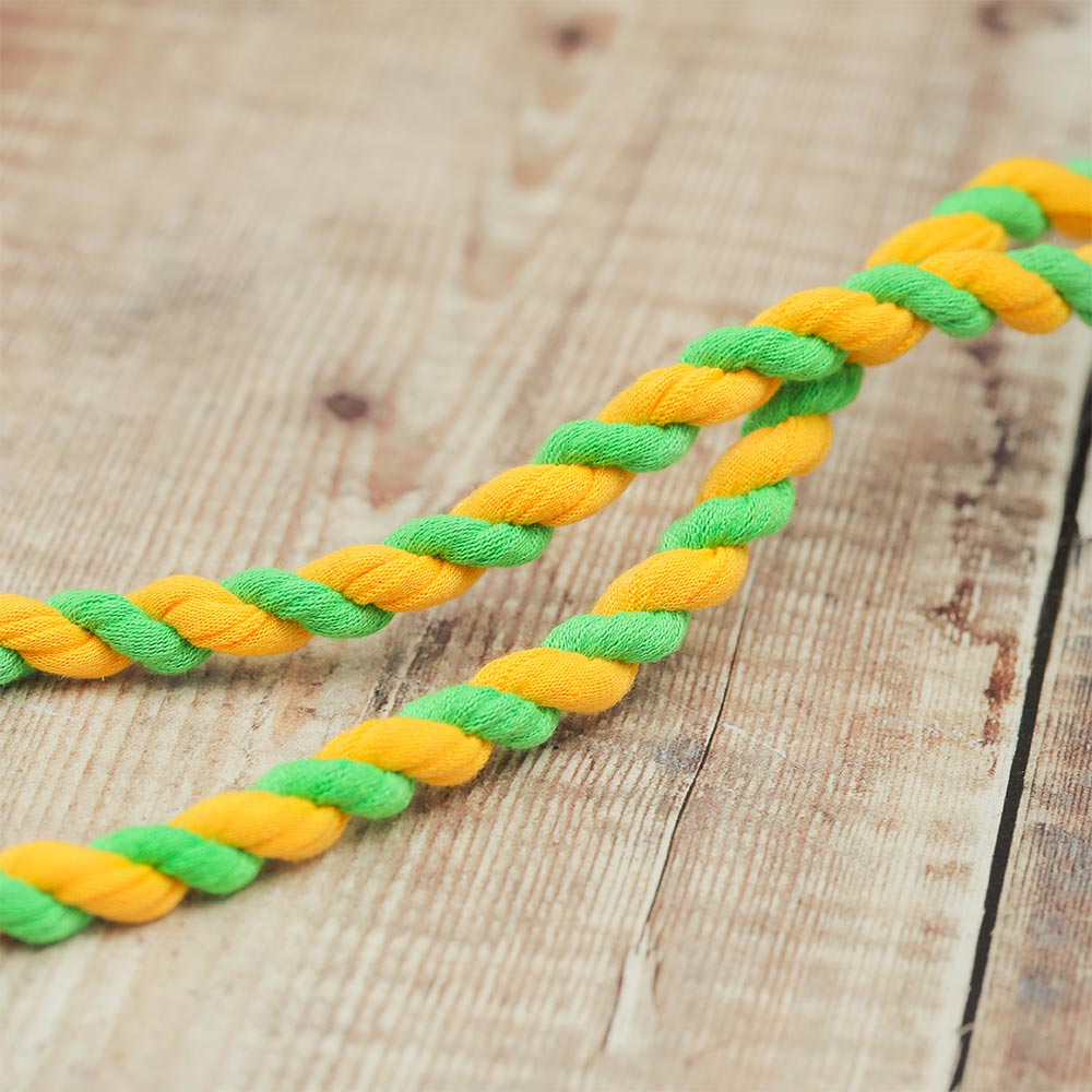 Close-up of the Lima rope nut shaker showing yellow and green rope detail.