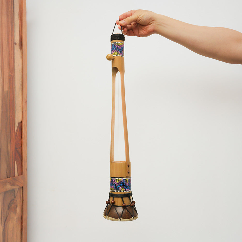 Small Begijen Ektara, an Indonesian string instrument, held in hand to show scale.