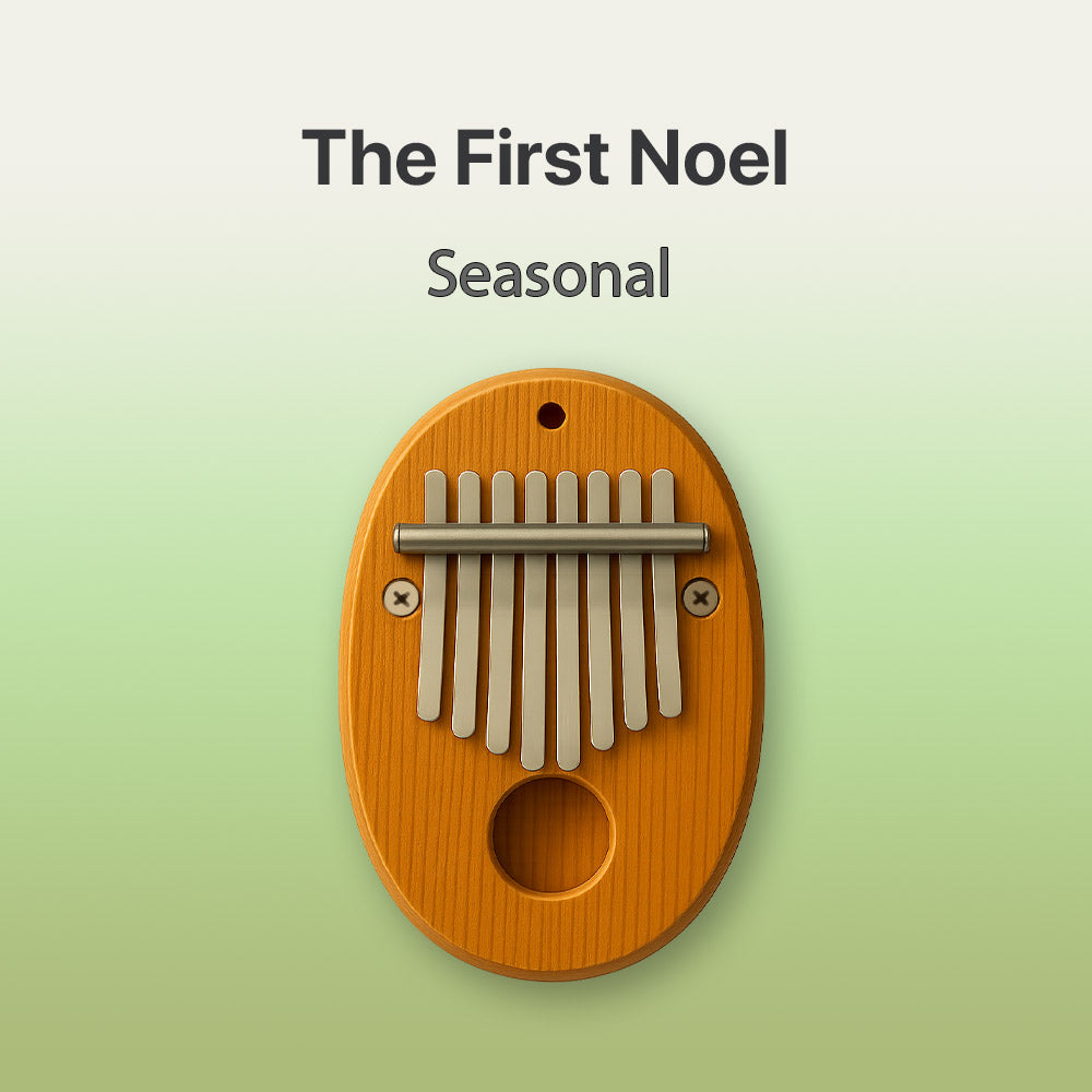 Wooden kalimba with 'The First Noel Seasonal' text on a green background