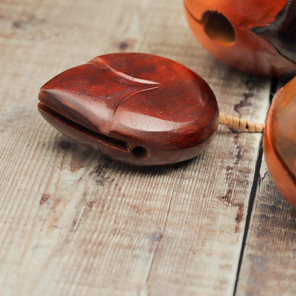 Close-up of one of the hand-carved wooden knockers of the Vietnamese Lotus clacker percussion instrument.