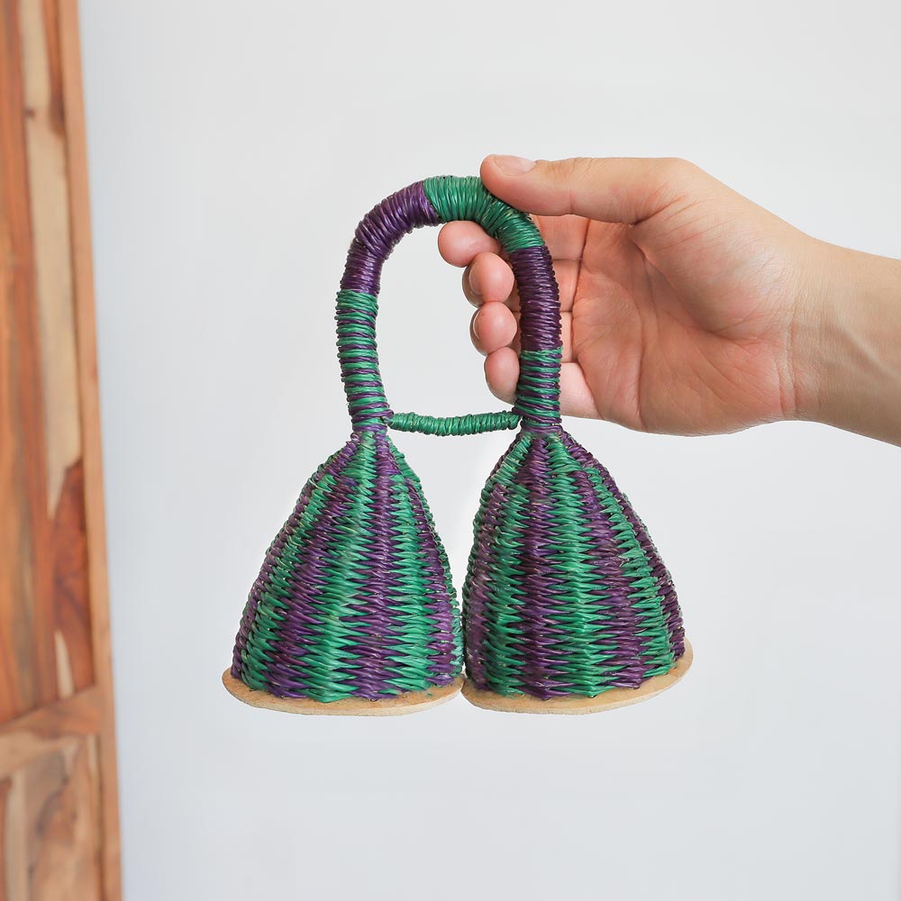 green and blue double caxixi shaker in hand