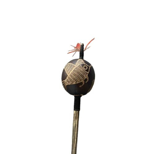 Decorative maraca with a bird design on a white background