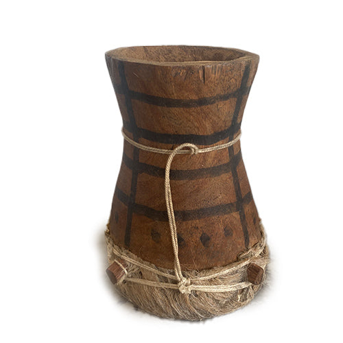 Bottom of a small African Kpanlogo drum on a white background