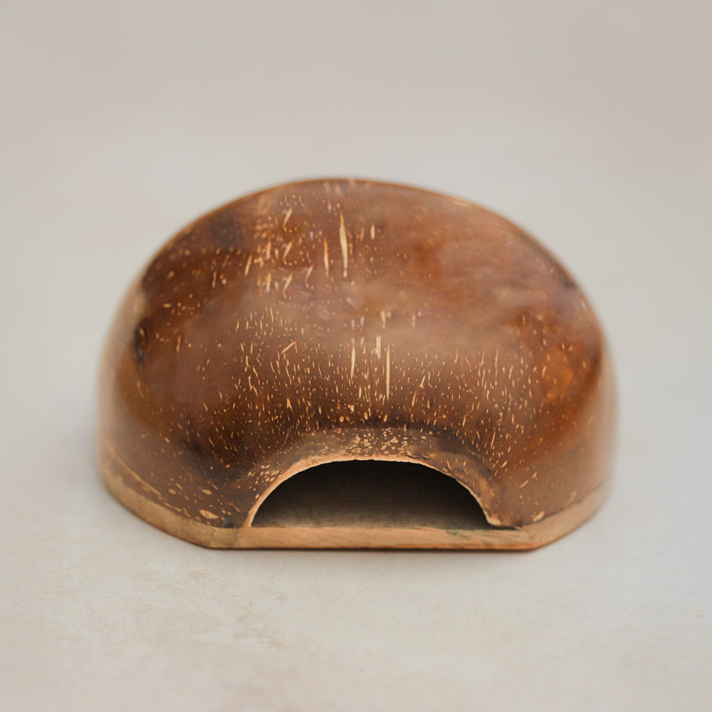 underside of coconut hand drum