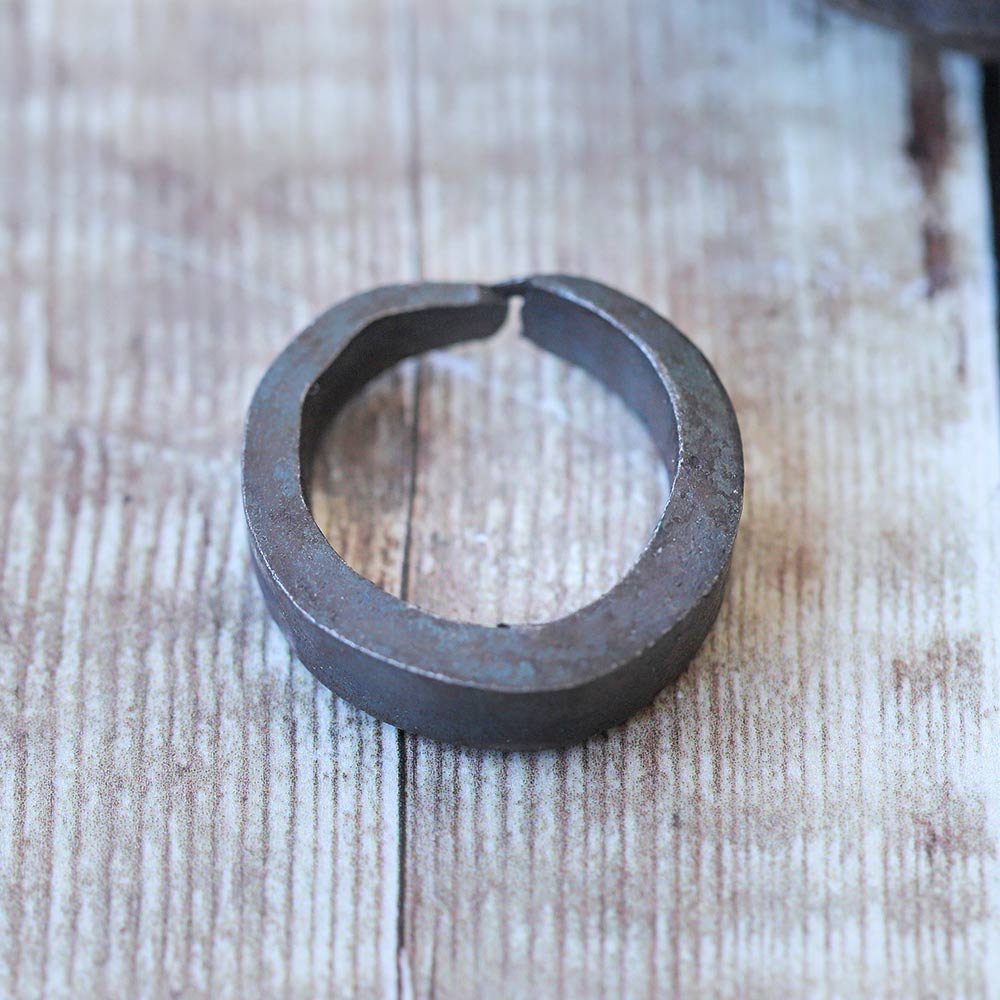 close up of metal grello finger bell ring