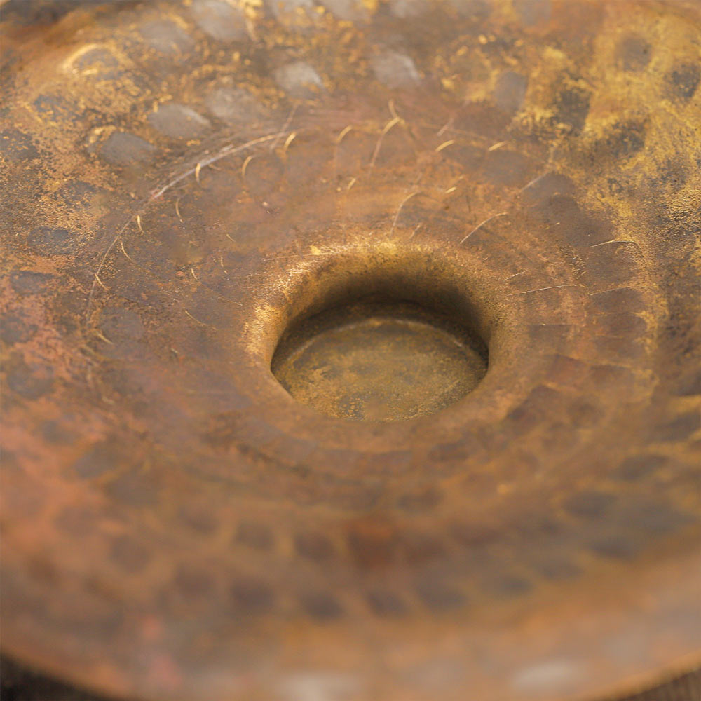 A close up of the hand cymbals