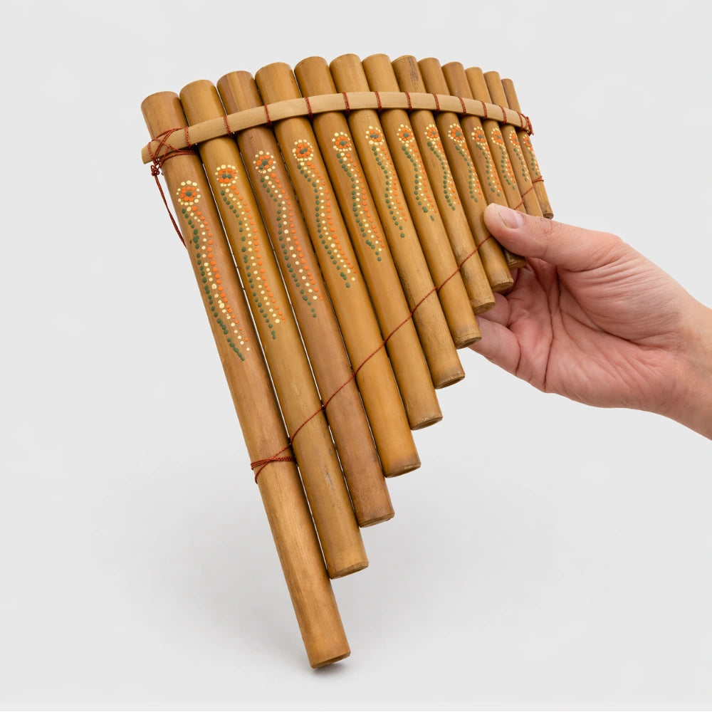 bamboo pan pipes held in hand at the beach
