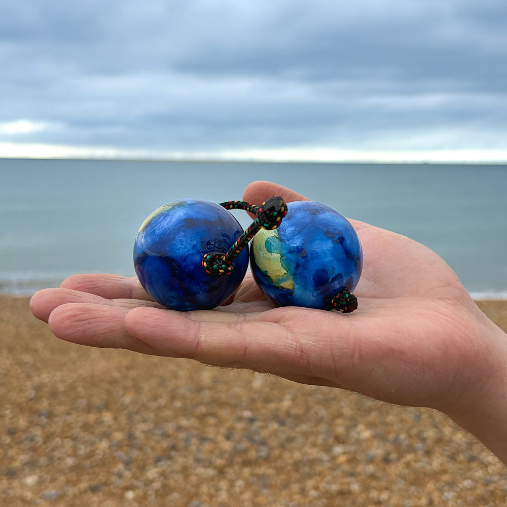 ocean design kashaka in hand against ocean