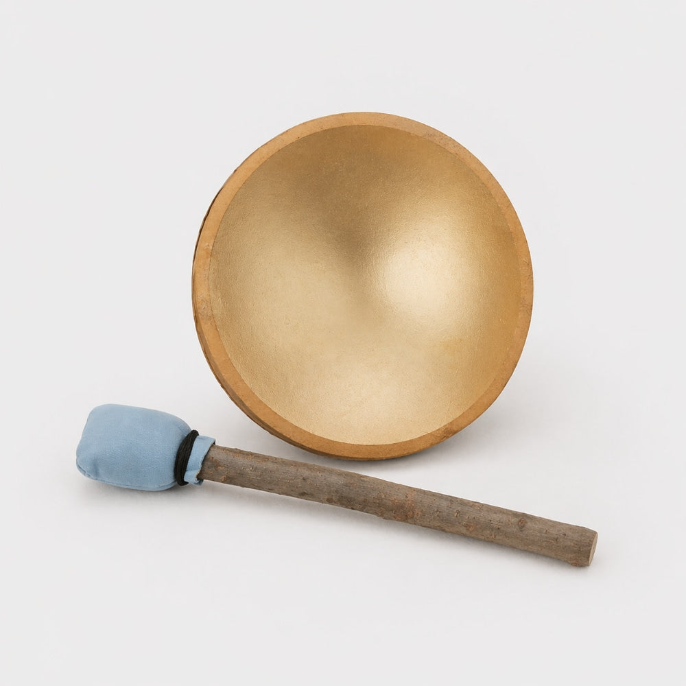 Animal hide khenji shamanic drum with blue tip wooden beater on a white studio background