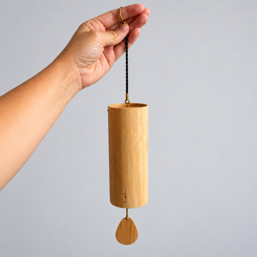hand holding koshi wind chime