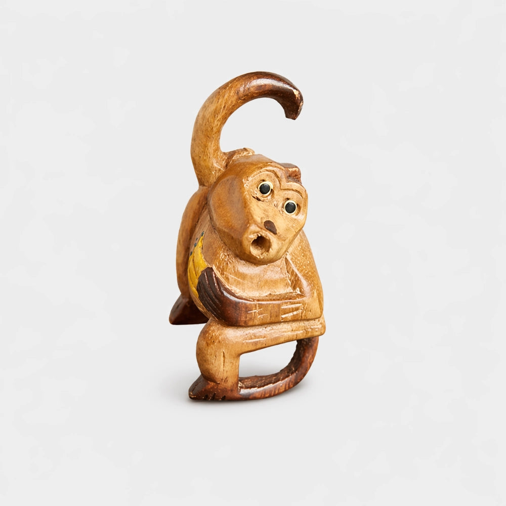 monkey flute holding bunch of bananas