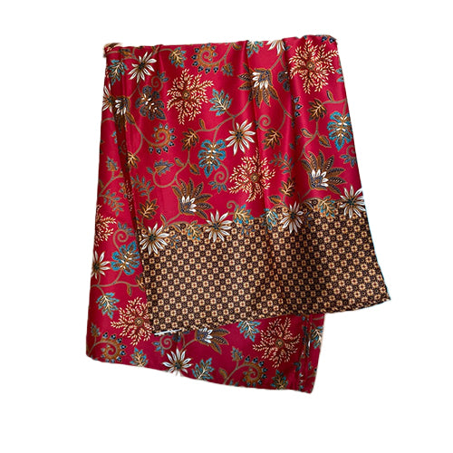 A red silk sarong with a floral pattern, displayed on a plain background.