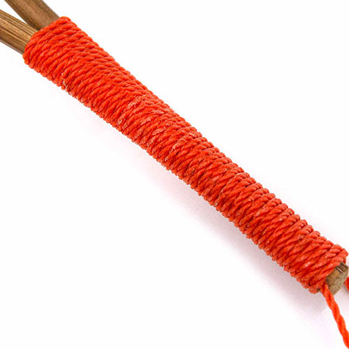 Close up of woven red handle