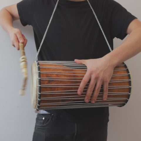 African talking drum in shape of hourglass