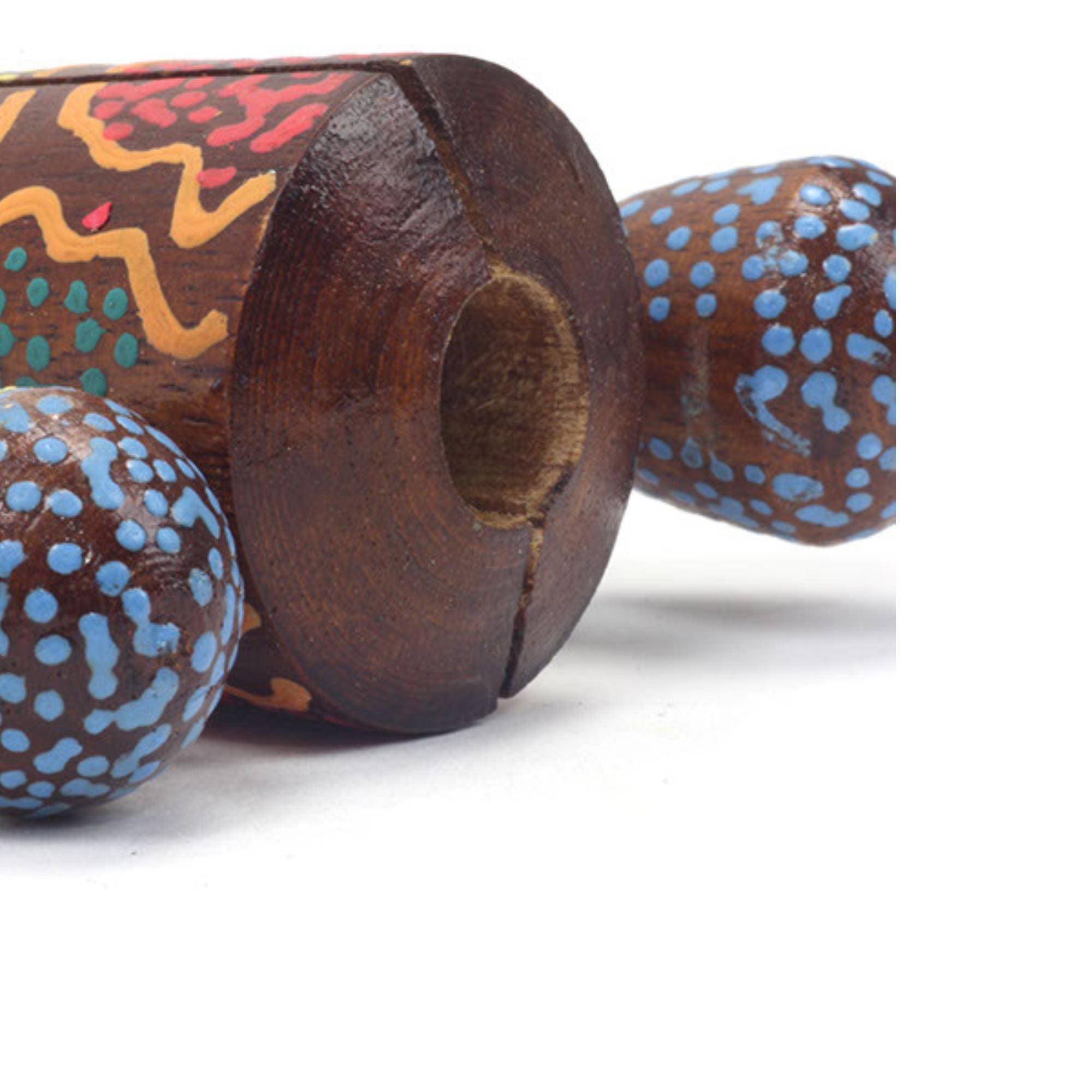 Close up of dot painted design wild man clacker