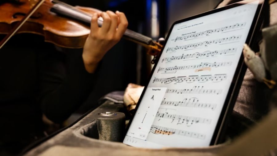 A tablet displaying Enote software, showing digitally reconstructed musical notation created through optical music-recognition technology.