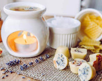 white ceramic oil burner with wax melts and essential oil