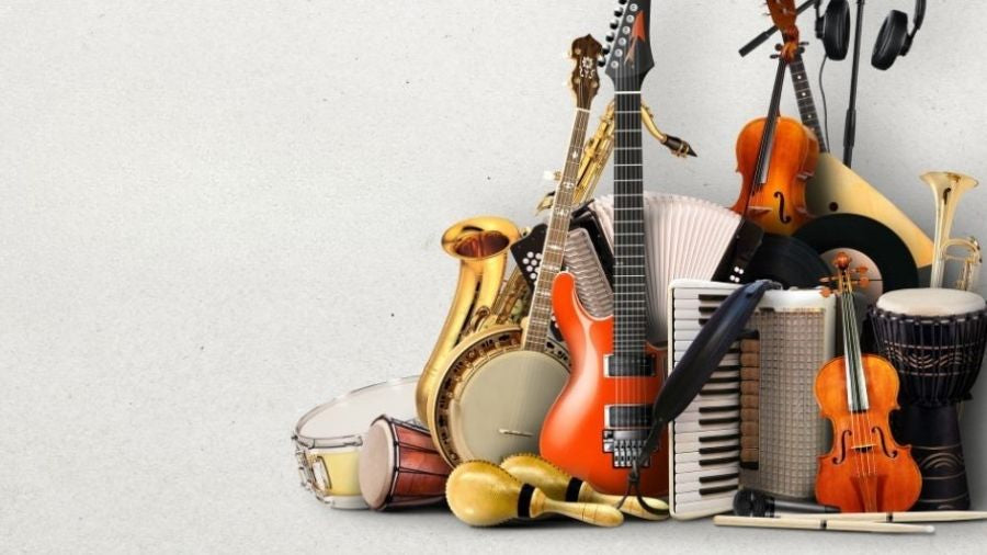 Travel-friendly musical instruments arranged on a gray background.