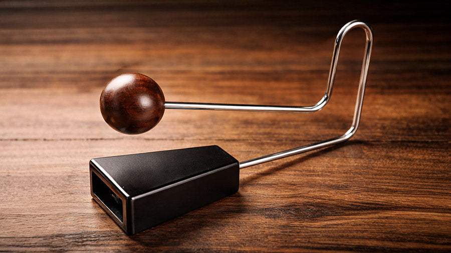 Wooden Vibraslap on a wood surface background