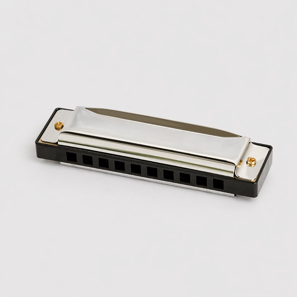 silver diatonic harmonica white background