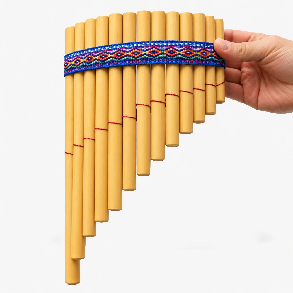 13-note Peruvian siku bamboo panpipes held in hand to show scale. Traditional woodwind pan flute.