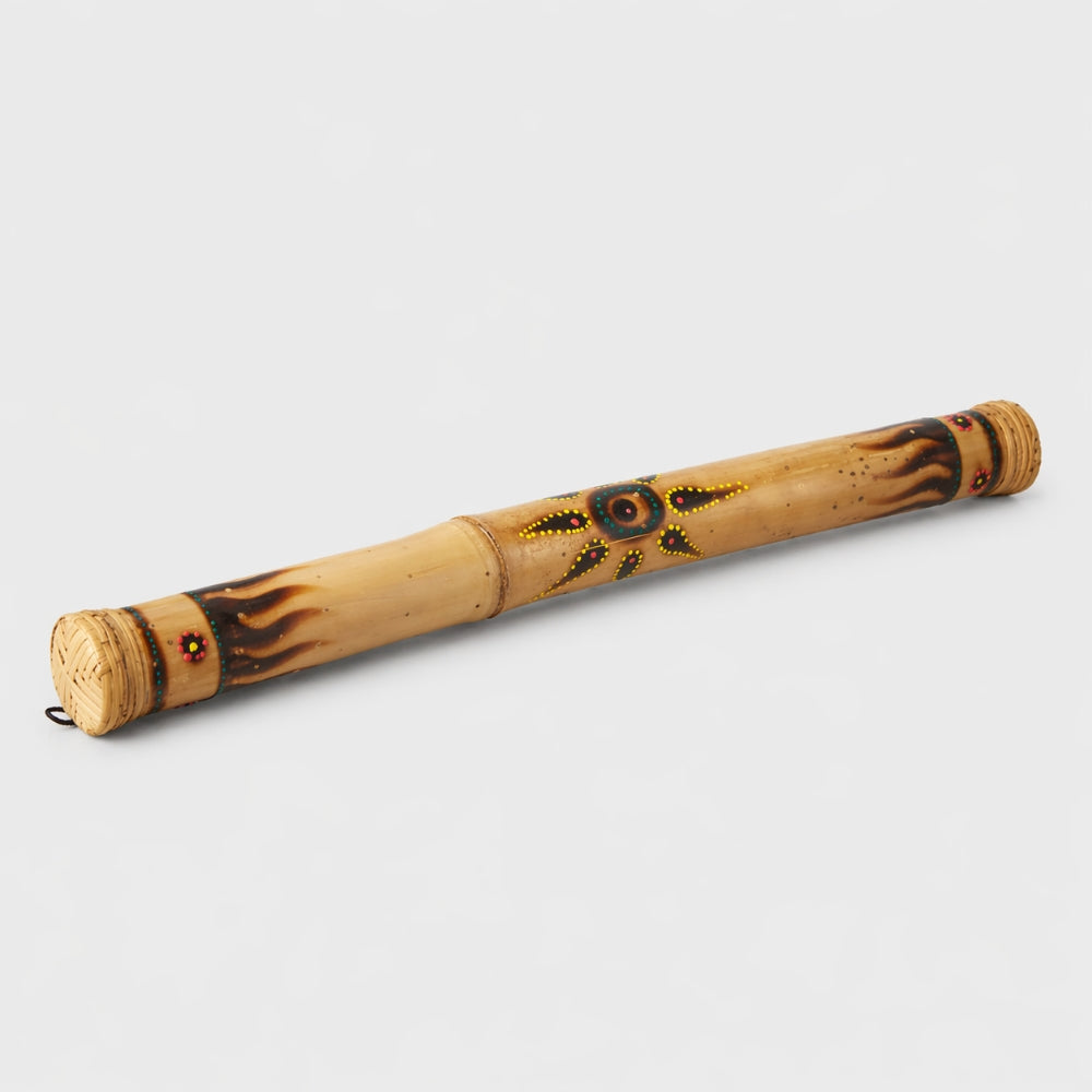 bamboo rainstick dot painted on grey background