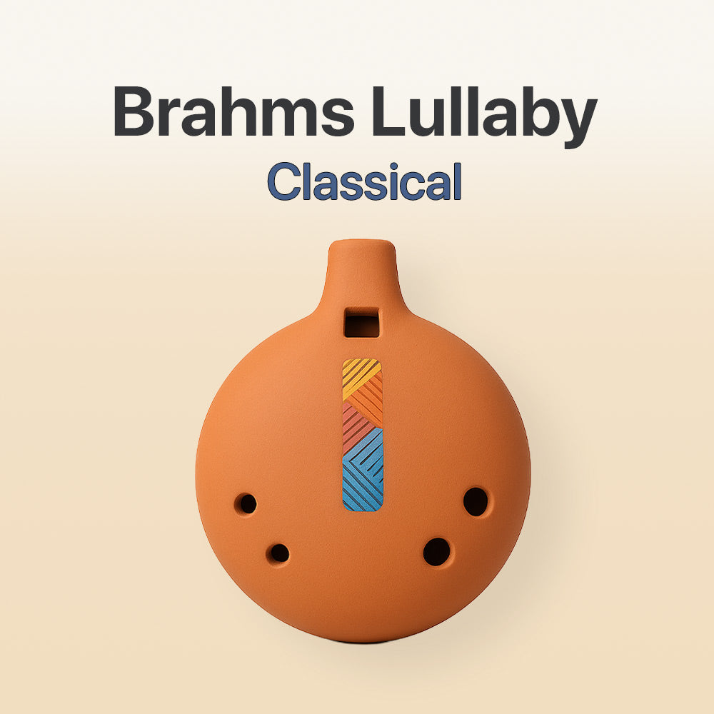 Ceramic ocarina with colorful design on a beige background, labeled 'Brahms Lullaby Classical'.