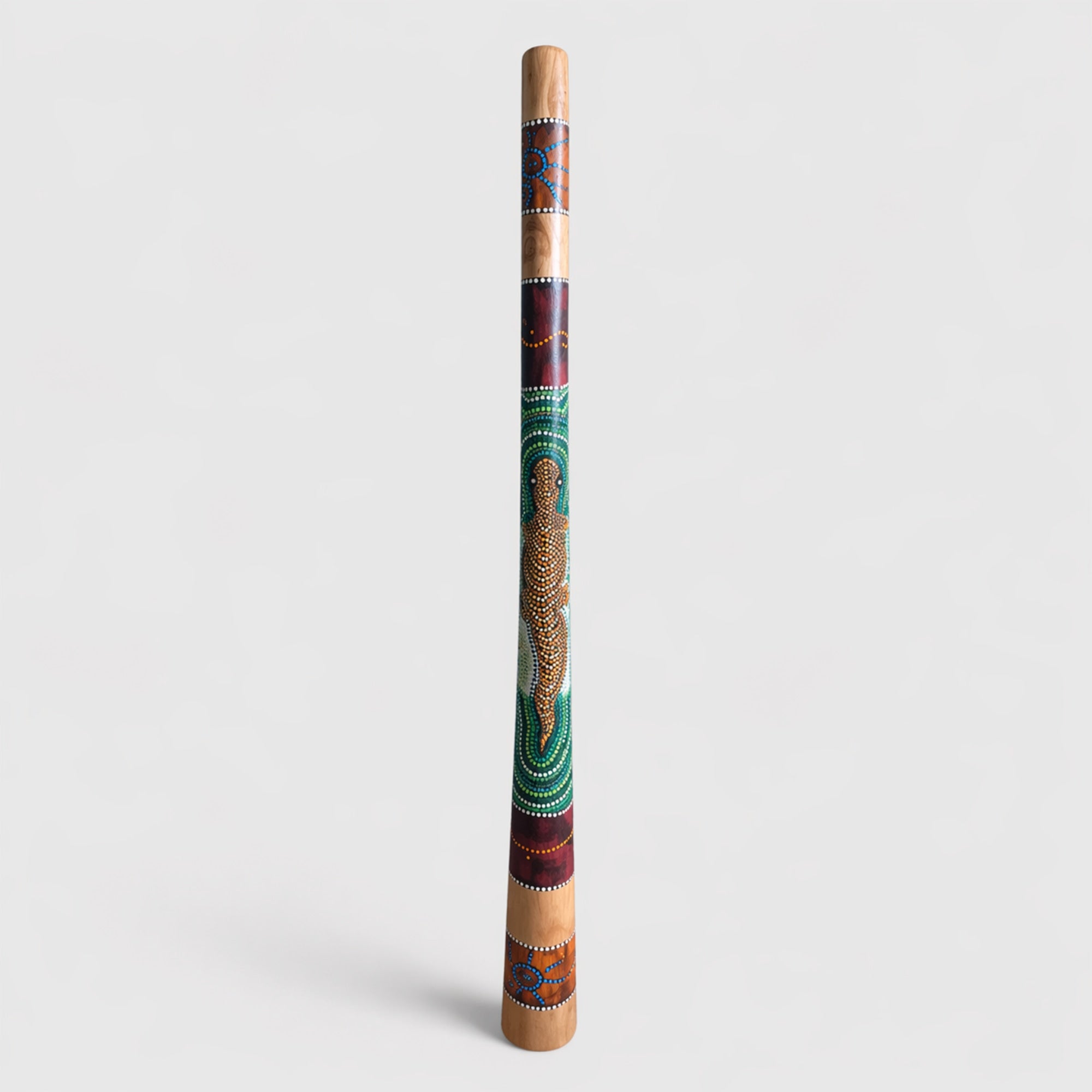 Decorative Full size hand painted melaya wooden didgeridoo with colorful patterns on a white background