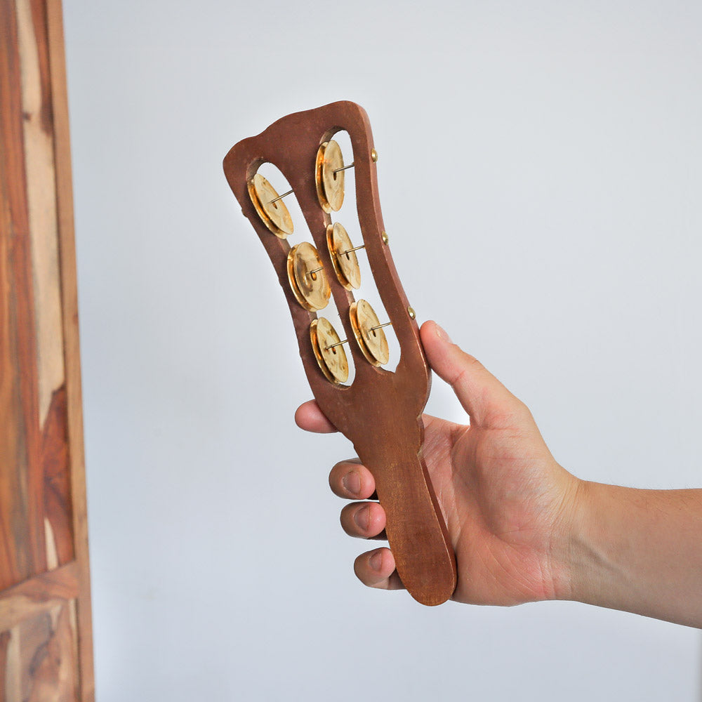 khartal paddle shaker in hand 