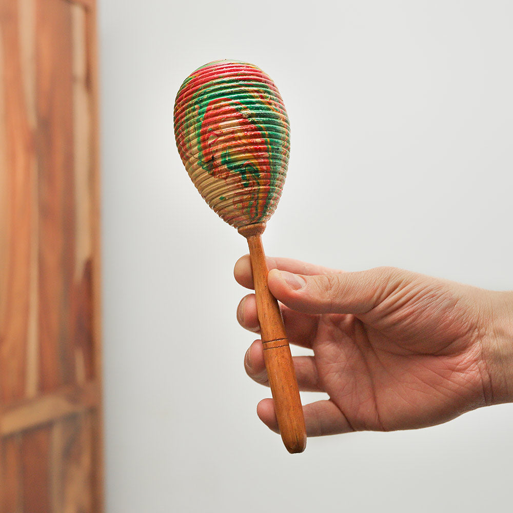 Single Pesona shaker held in hand, showcasing its size and design.