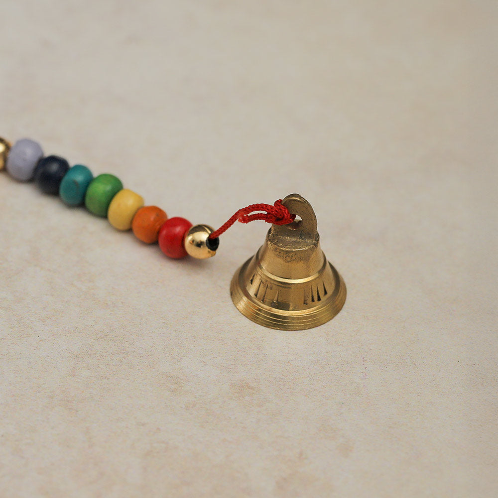 Close-up of the Small Bihar Cowbell Windchime, highlighting the metal bell and colorful beads.