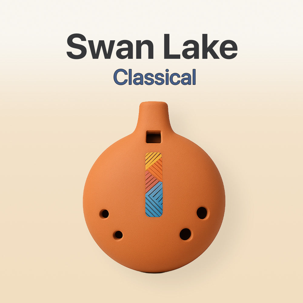 Ceramic ocarina with geometric design on a beige background, labeled 'Swan Lake Classical'.