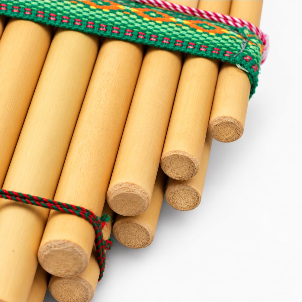 Close-up of the bottom of the bamboo Zanpona panpipes showing the sealed ends and how the tubes are attached together.